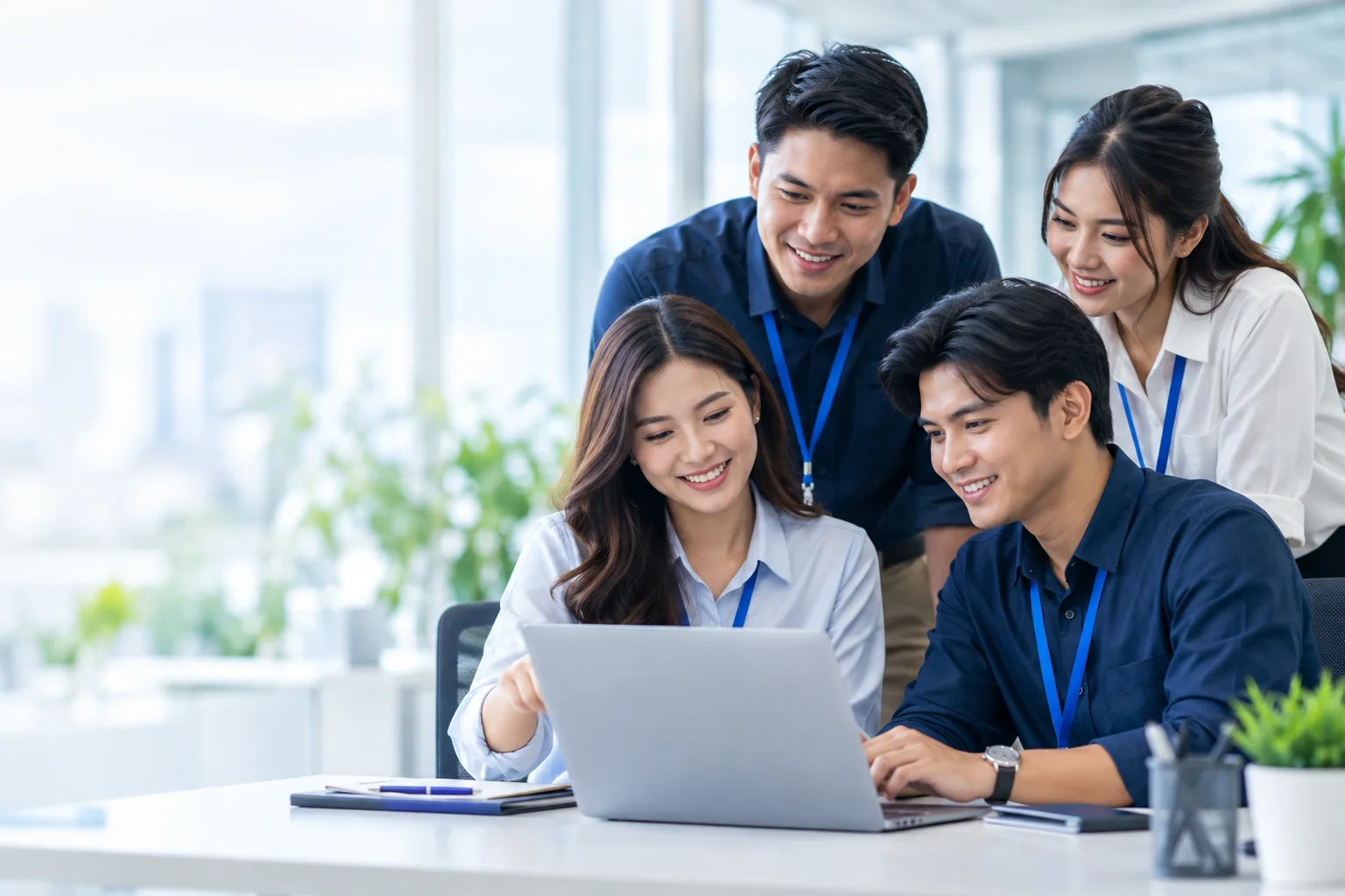 Illustrative scene of Filipino professionals collaborating around a laptop